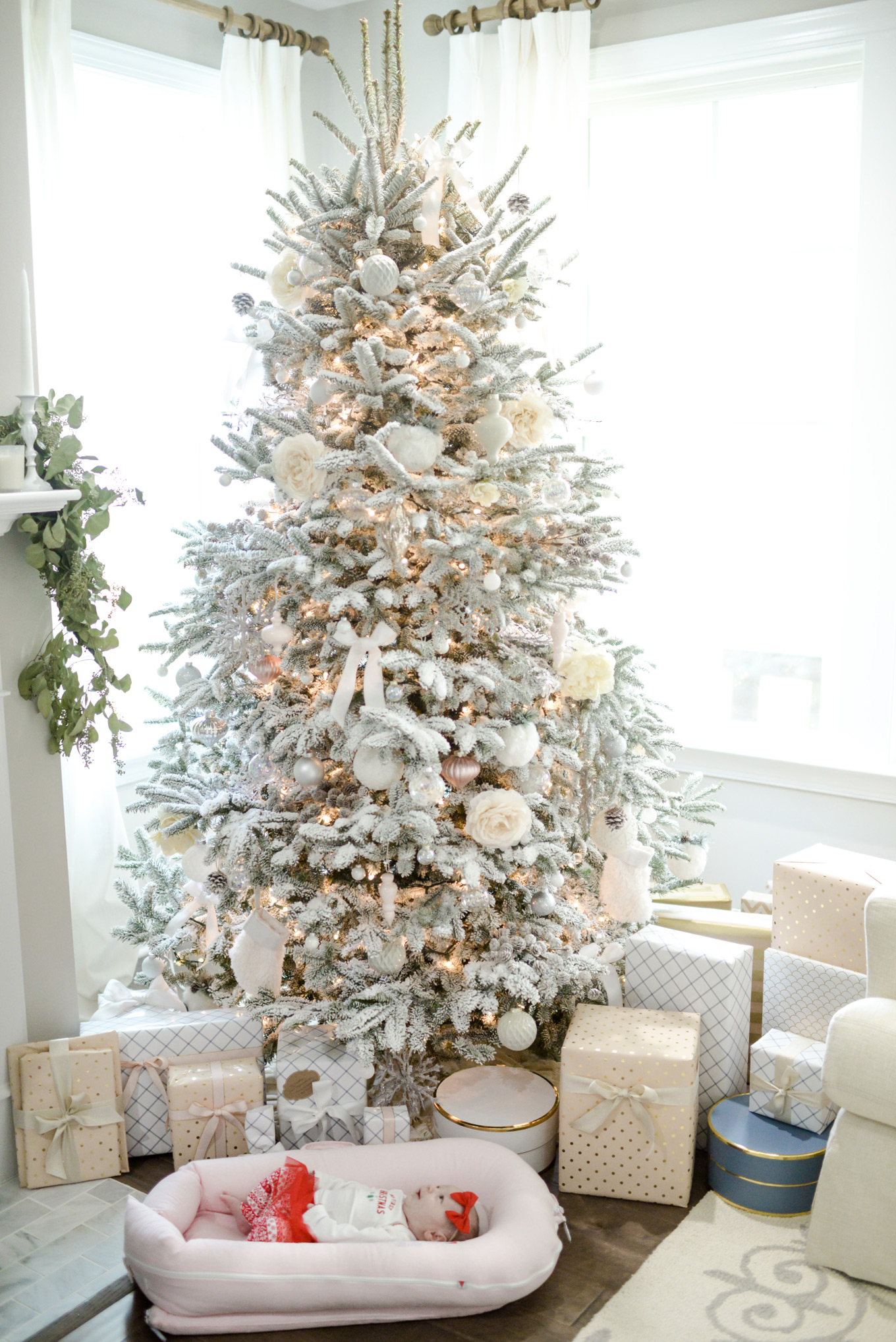 A baby and presents | Lifestyle Blogger Elle Bowes shares holiday home decor ideas.