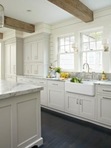 Dreamy wooden beams and farmhouse sink | Lifestyle blogger Elle Bowes | White kitchen decor ideas