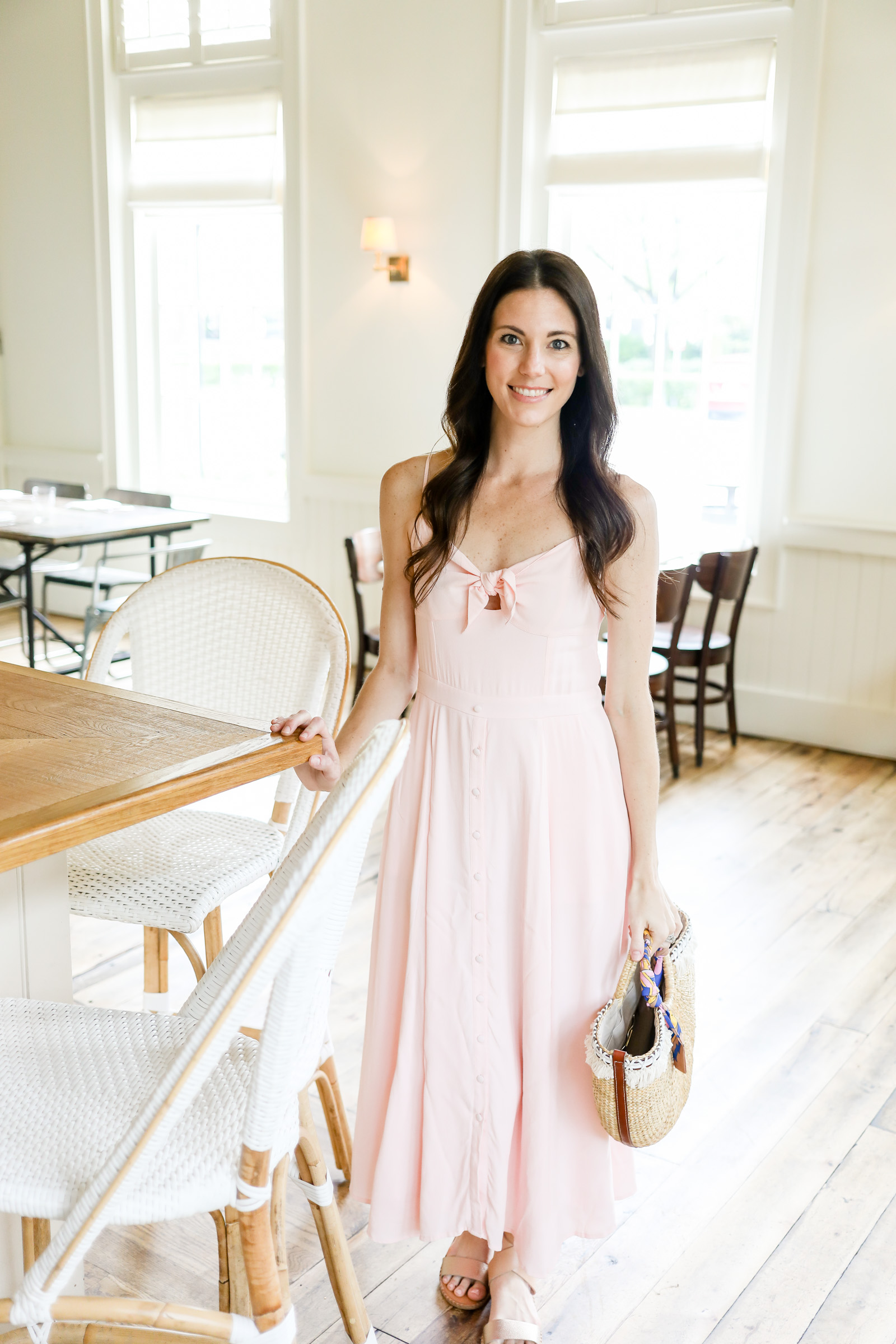 pink bow tie front dress by yumi kim | pink dress | straw tote | pink midi dress | every day joie by elle bowes