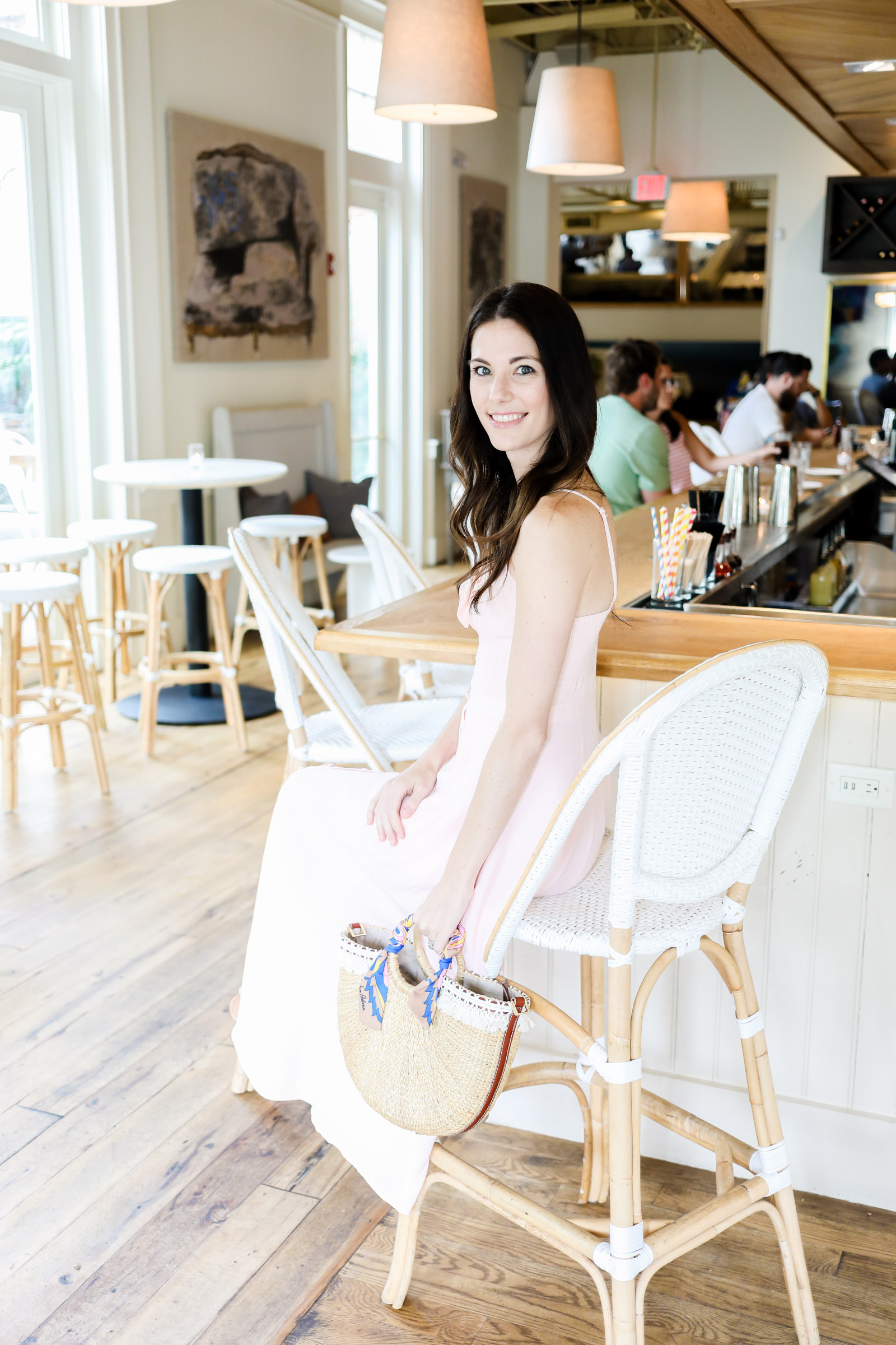 pink bow tie front dress by yumi kim | pink dress | straw tote | pink midi dress | every day joie by elle bowes